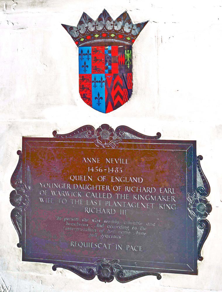 Brass plate to Anne Neville, with an heraldic shield, erected in Westminster Abbey near her burial place