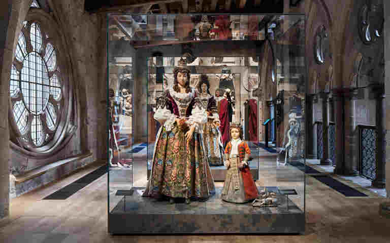 Wax effigies of the Duchess of Buckingham, her son Robert and a toy unicorn on display in a glass case in the Queen's Diamond Jubilee Galleries, Westminster Abbey