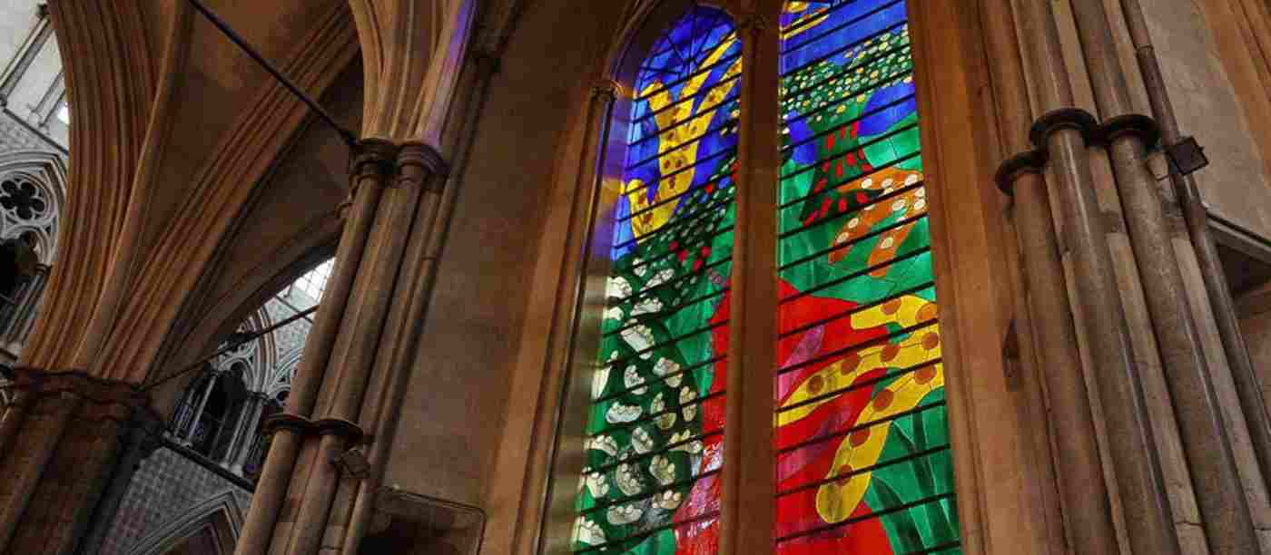 The Queen's Window by David Hockney, a colourful stained glass window showing a country scene