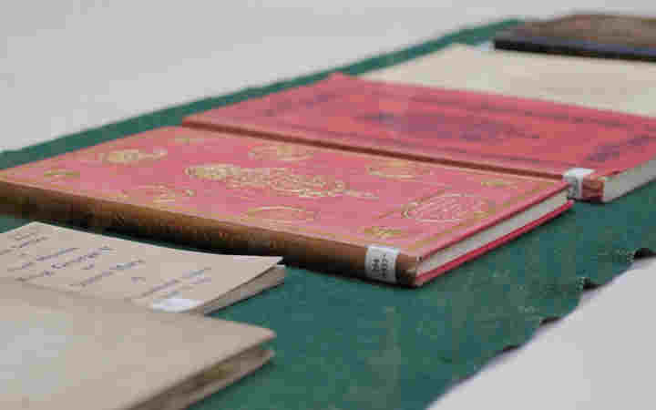 Photograph of multiple Coronation Order of Services at Westminster Abbey