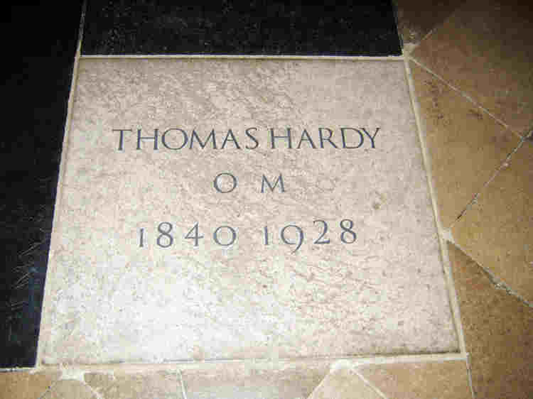 White gravestone of Thomas Hardy reading: 'THOMAS HARDY O.M. 1840 1928'