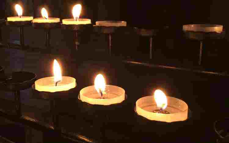 Lit votive candles in Westminster Abbey