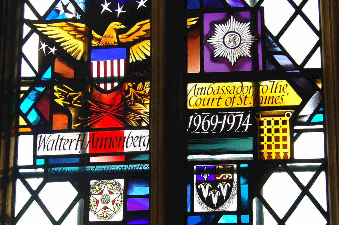 Detail of the memorial window to Walter H. Annenberg, showing the USA coat of arms and Anneberg's UK honours