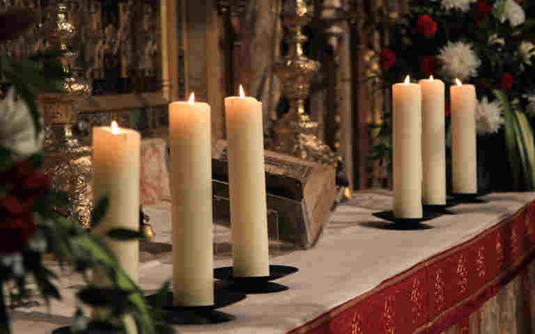 Photograph of candles on an altar in Westminster Abbey, representing faith