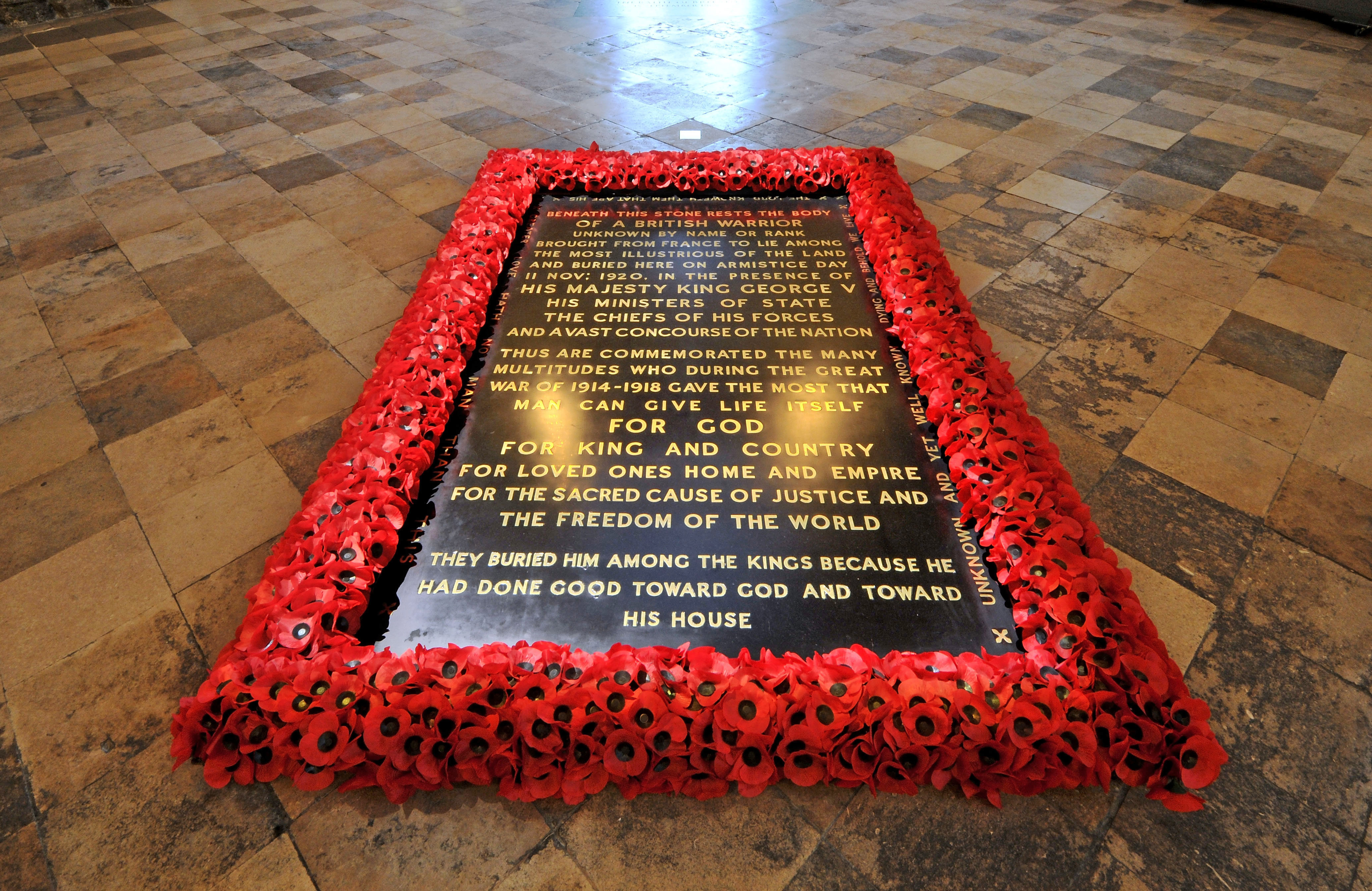 The Grave of the Unknown Warrior: a black marble gravestone set into the floor, bordered by red poppies