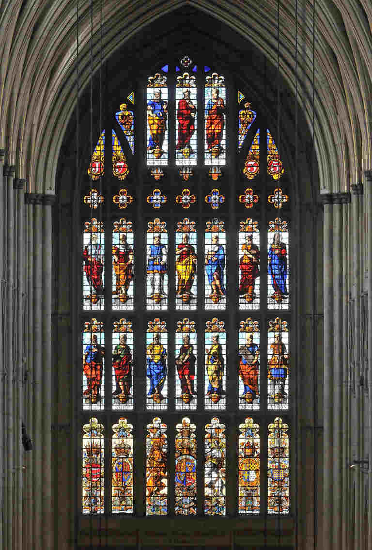 Elaborate stained glass window showing portraits of soldiers and their coats of arms