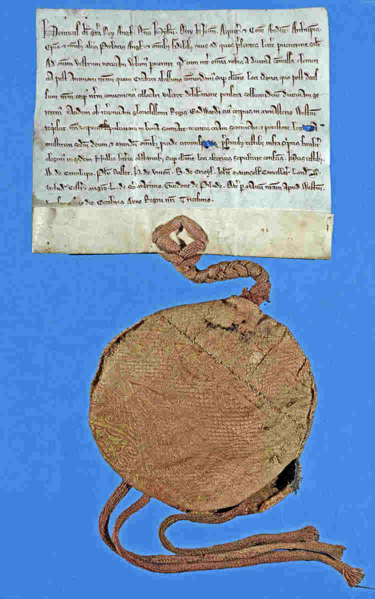 A seal bag attached to an old manuscript page