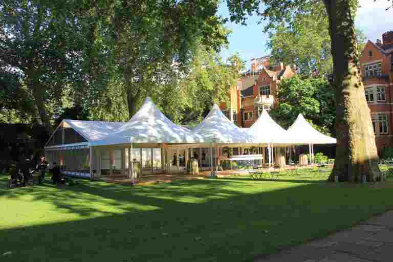 A large glass marquee on Westminster Abbey's College Garden lawn
