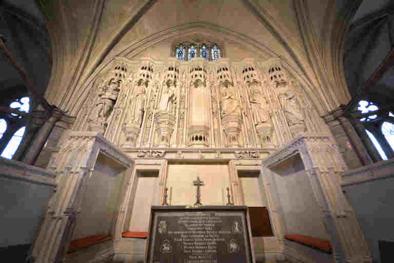 Henry V's Chantry Chapel, a small altar of engraved black marble with statues above