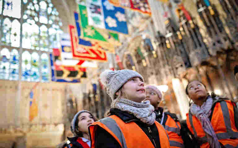 Photograph of primary school students on a tour at Westminster Abbey