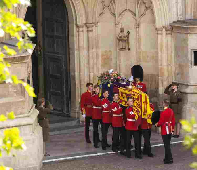 Guardsmen carrying the coffin of Elizabeth II out of the Abbey after her funeral.