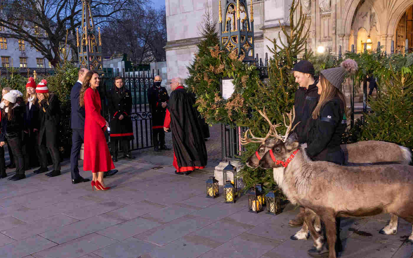The Duke and Duchess of Cambridge outside the Abbey with reindeer and Christmas trees