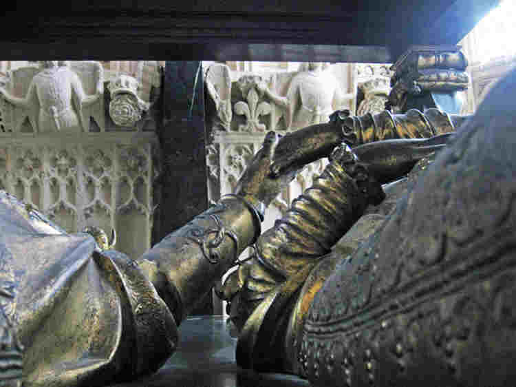 A view of the tomb effigies holding hands