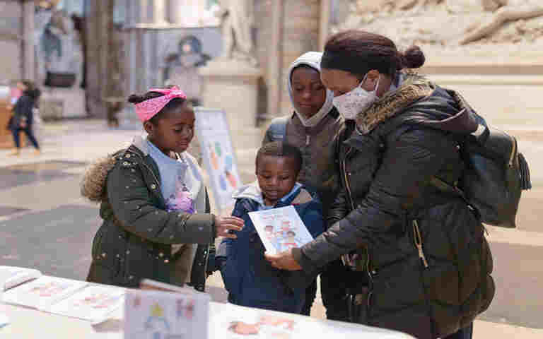 Photograph of families wearing masks visiting Westminster Abbey