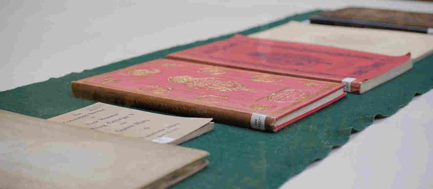 Photograph of multiple Coronation Order of Services at Westminster Abbey