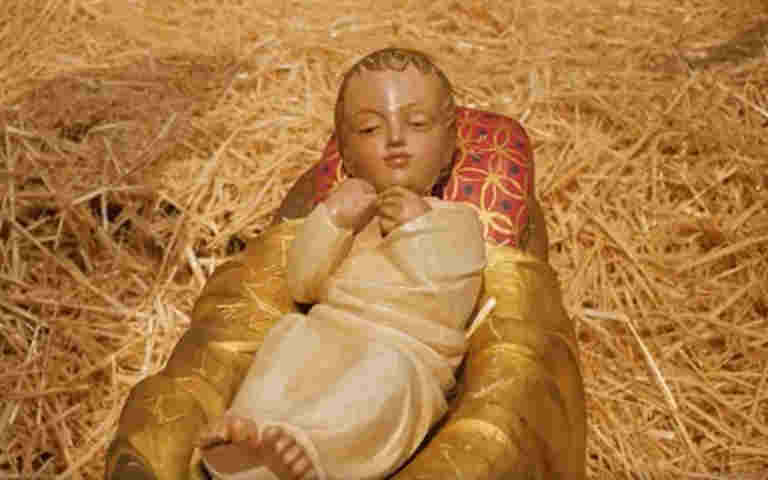 Photograph of baby Jesus Christ in the nativity scene at Westminster Abbey, representing the baby in the Bible