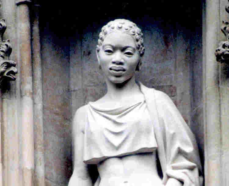 Photograph of Manche Masemola statue, one of 10 modern martyrs above the Great West Door at Westminster Abbey