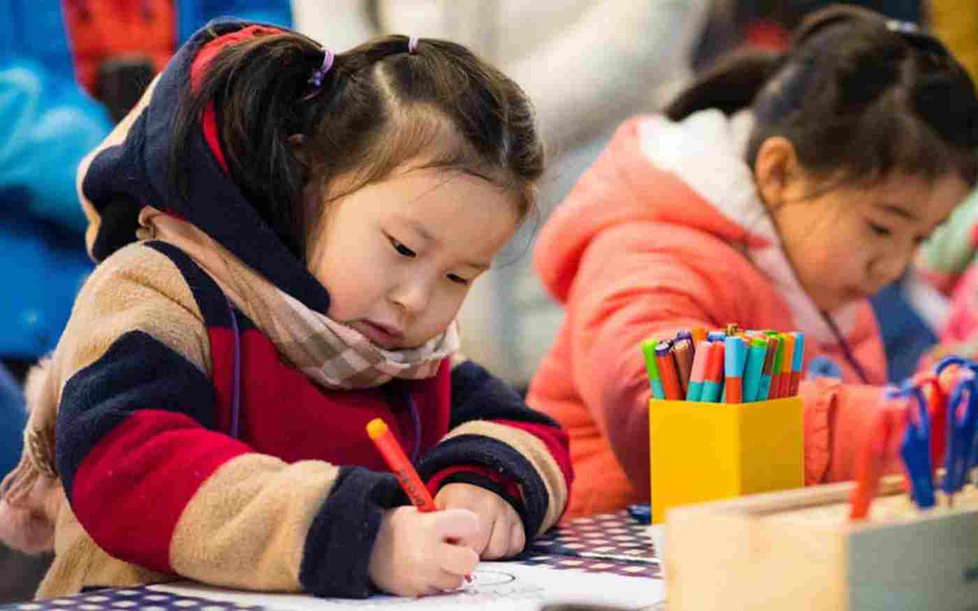 Young children taking part in a colouring-in activity at Westminster Abbey