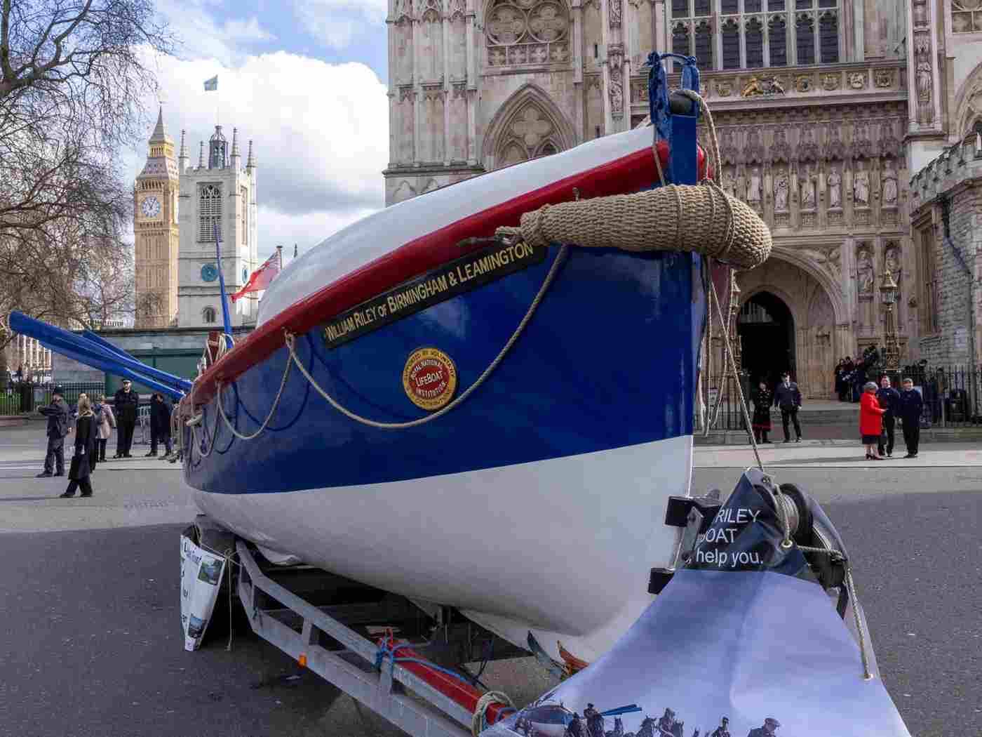 A blue and white oar-powered lifeboat