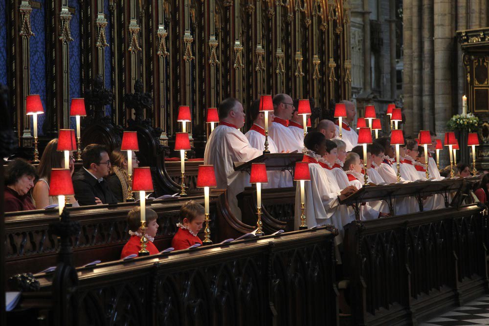 The Choir of Westminster Abbey sing at Evensong with congregants seated behind them
