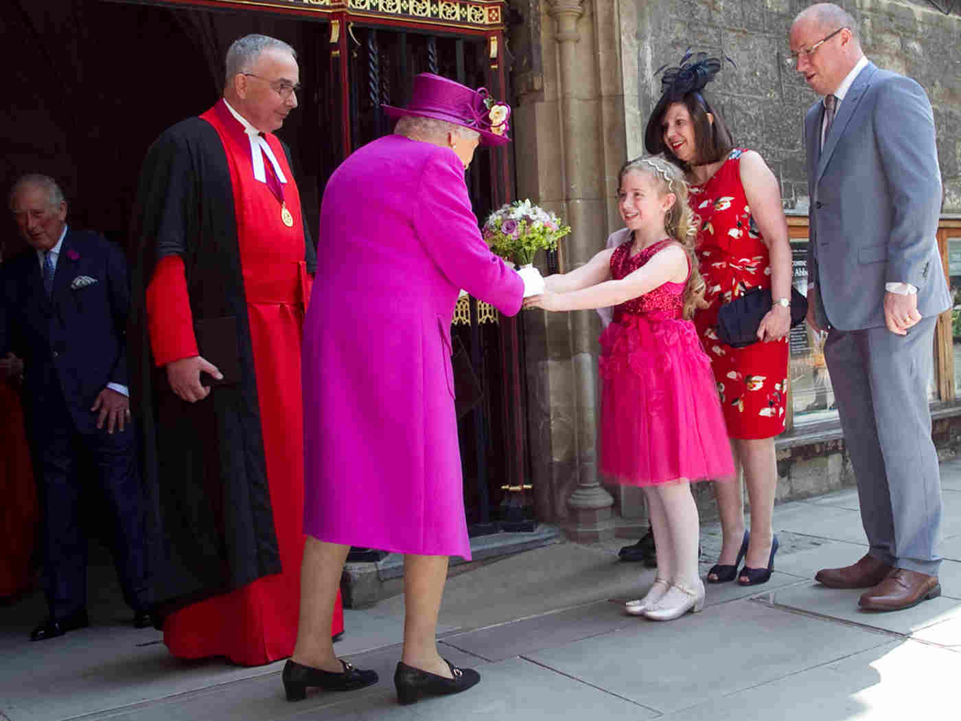 The Queen receives a posy from Sarah Bish, aged 8