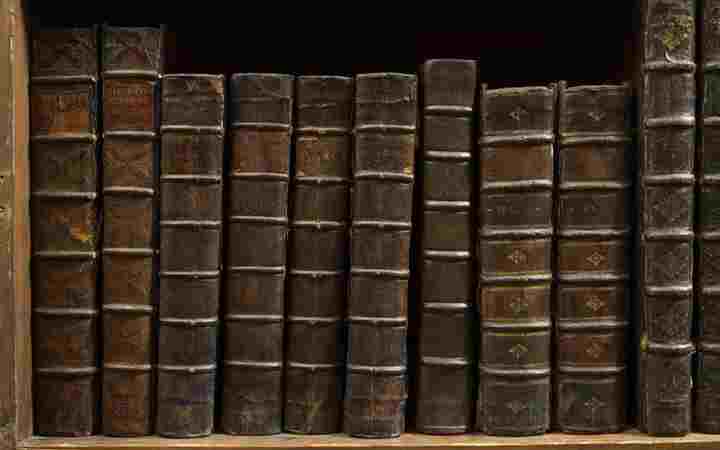 Brown leather-bound books in the Westminster Abbey Library